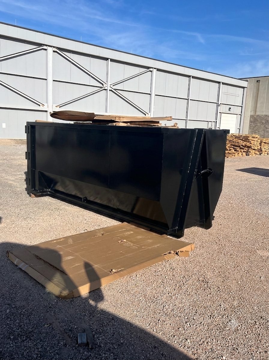 Roll-off dumpster on a job site during a cleanout